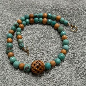 Blue and Brown Beaded Necklace with Carved Centerpiece